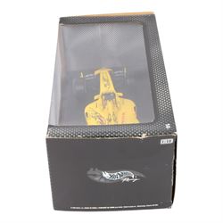 Three signed limited edition 1:18 scale Formula One models, comprising Hot Wheels Jordan EJ12 signed by Takuma Sato, Hot Wheels Jaguar Racing R2 signed by Eddie Irvine and a Minichamps Williams F1 Team model signed by Jenson Button, 1:18 scale model, all boxed