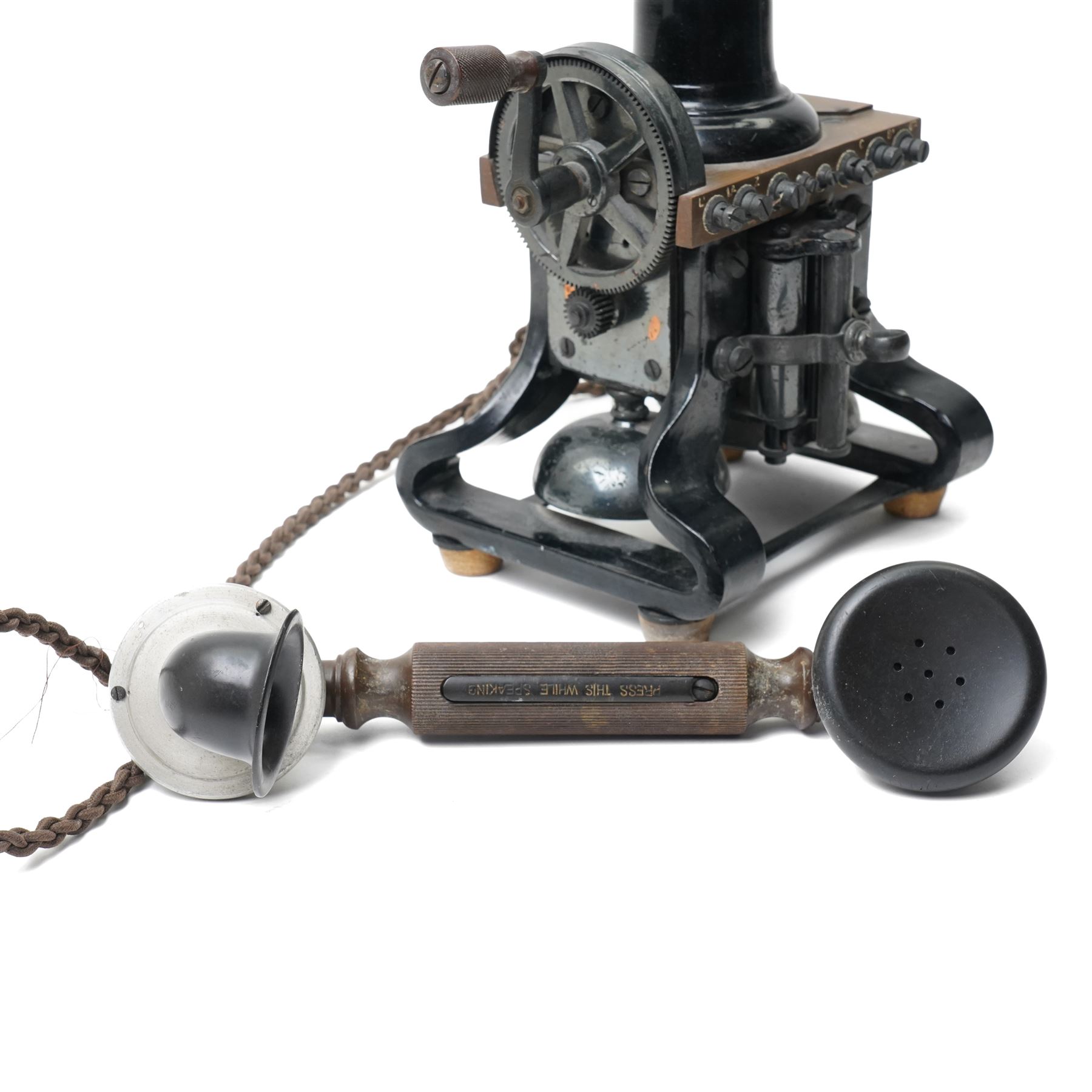 Early 20th century L M Ericsson & Co Skeletal table telephone, the earpiece impressed No.28, with black painted frame and possibly original wires, H29cm