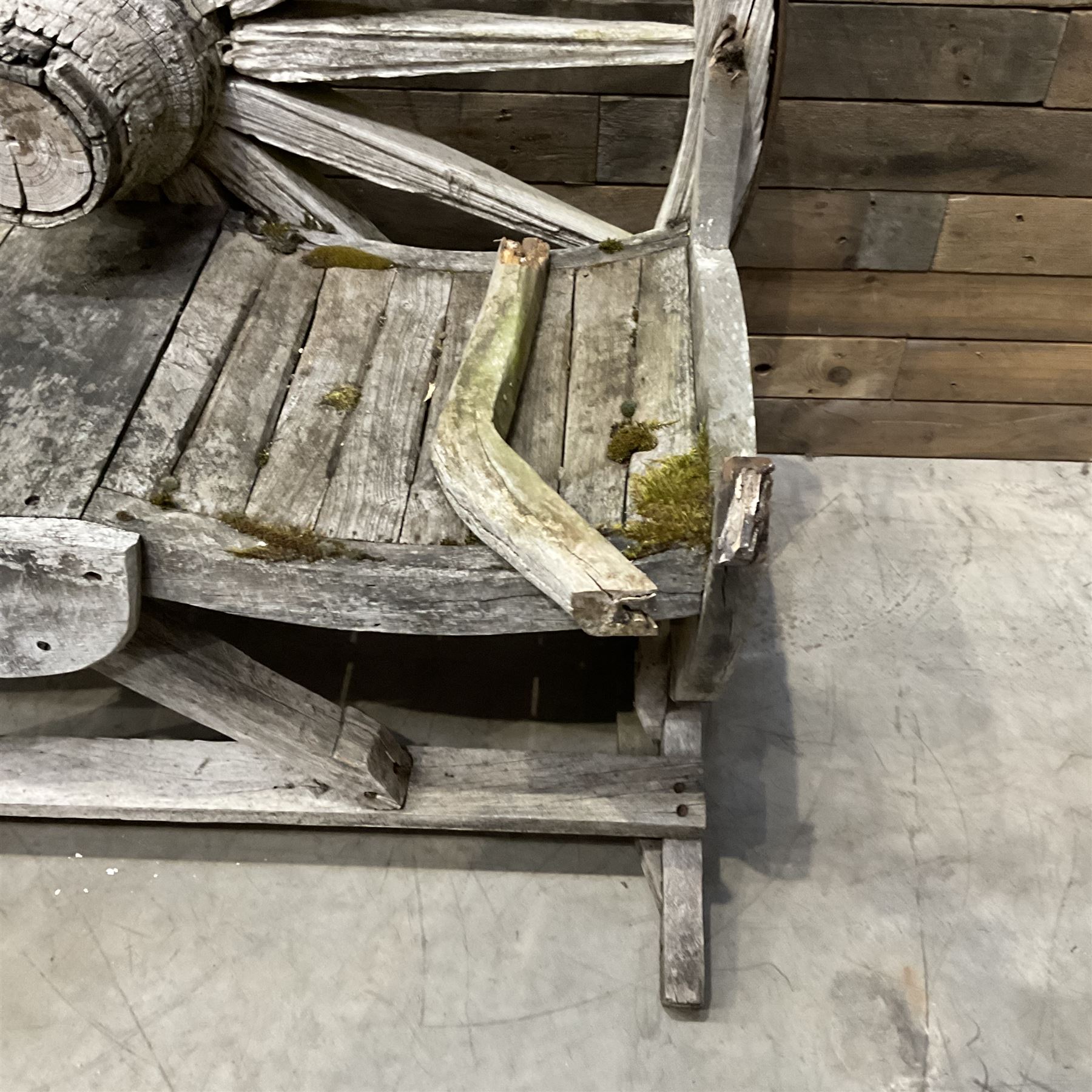 Early 20th century timber framed cartwheel garden bench