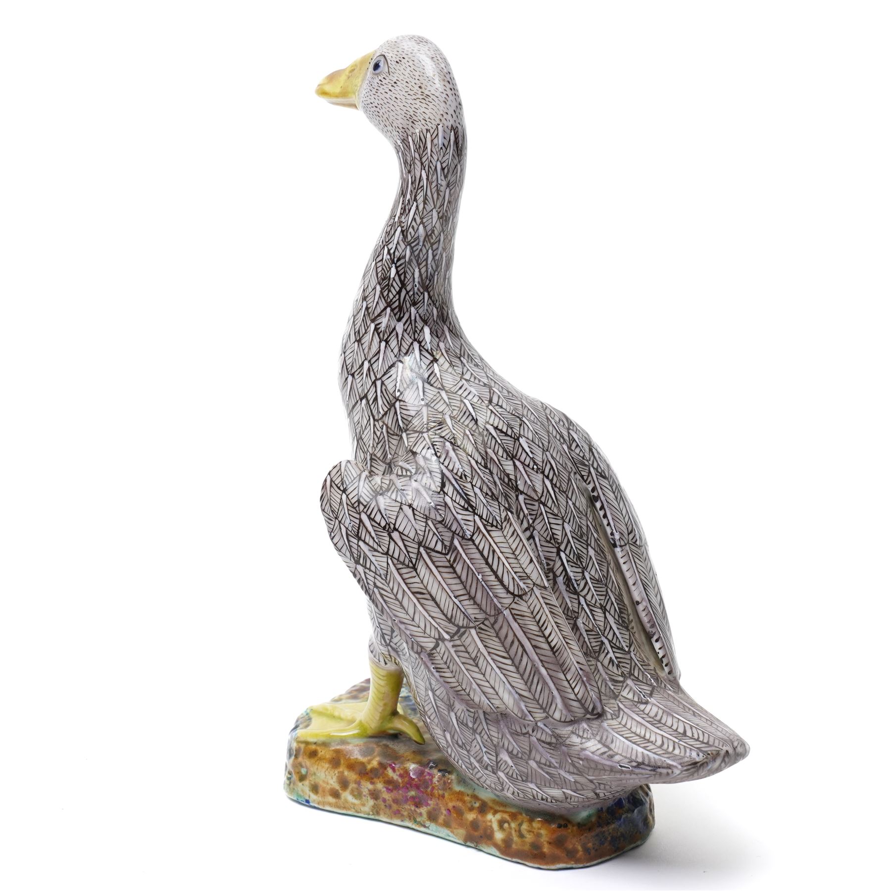 Pair of 20th century Chinese Export porcelain ducks, each naturalistically modelled with aubergine and white enamel plumage and seated on polychrome rockwork bases, H24cm 