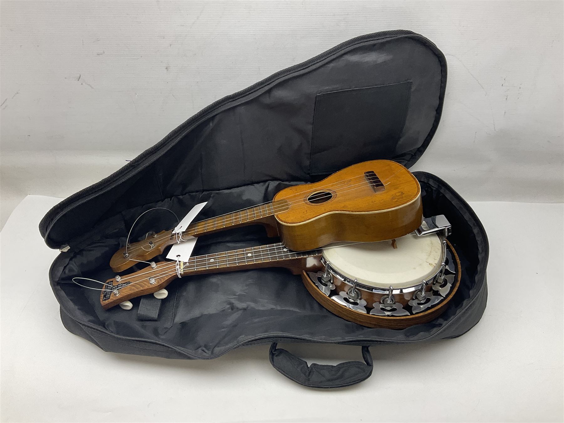 Trumelo BMI banjo ukulele no.3013 L58cm; in soft carrying case; and Kapok Brand guitar shaped ukulele L51cm (2)