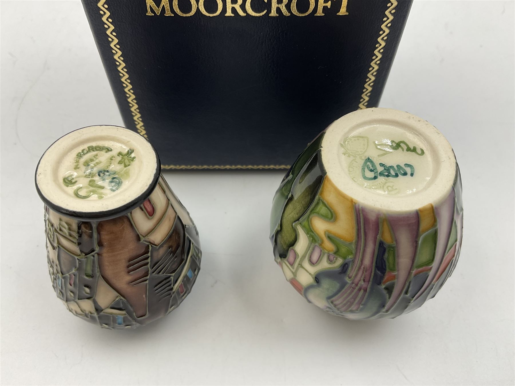 Two miniature Moorcroft vases, one decorated in the Lodge Hill pattern, circa 2007, H6cm,  and the other decorated in Made in Burslem circa 2011, H6cm  