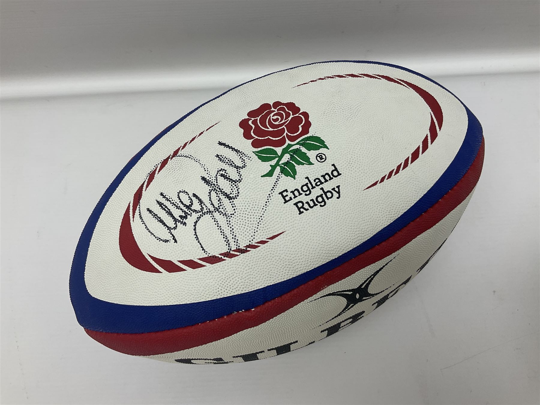 England Rugby official replica ball by Gilbert signed by Mike Tindall, together with a FIFA football