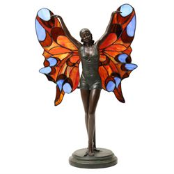 Tiffany style table lamp in the form of an art deco style bronzed female figure with butte...