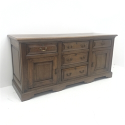 Late 18th century oak dresser, five drawers and two fielded panel cupboards, shaped plinth base, W188cm, H87cm, D63cm