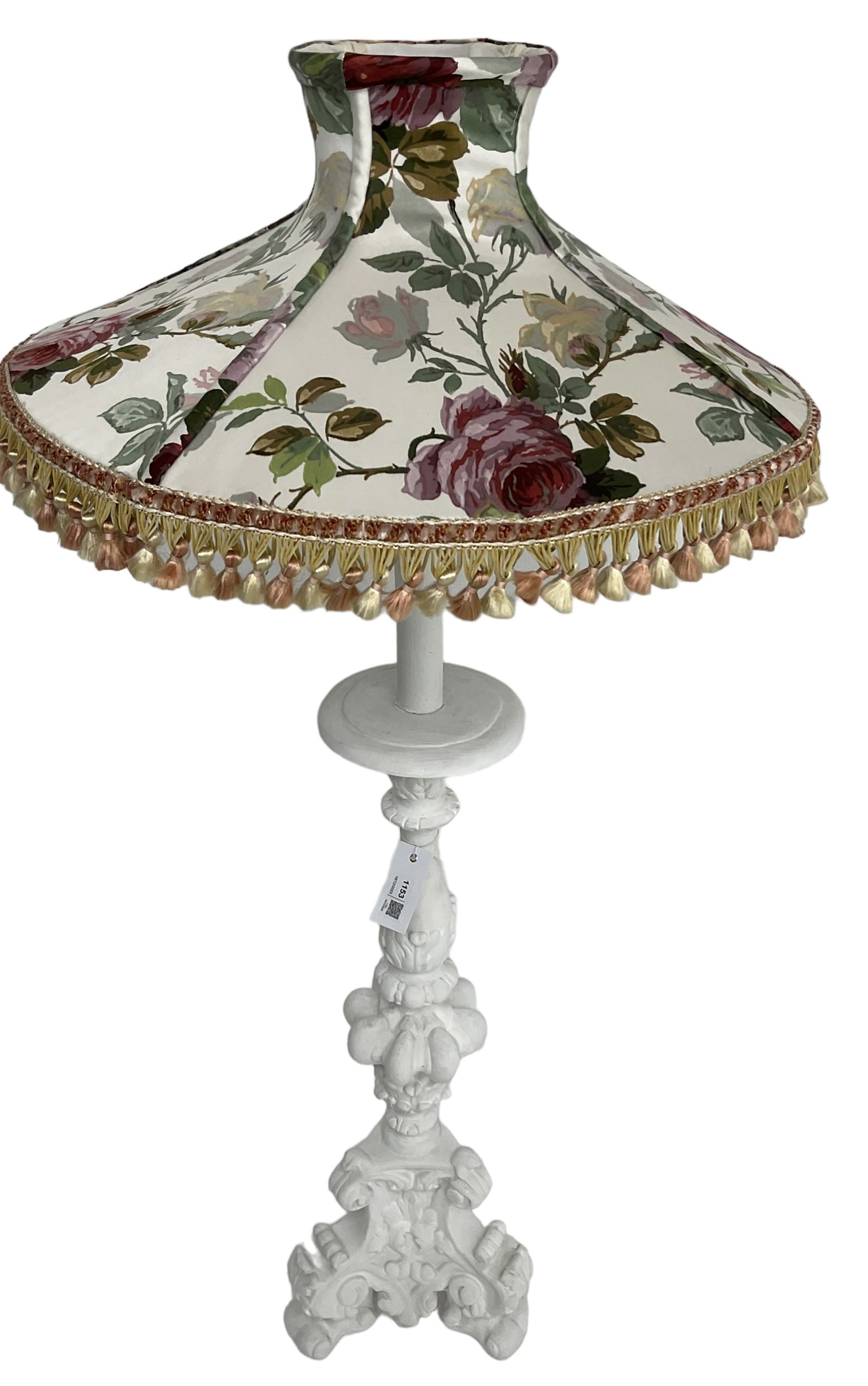 White painted Italian Baroque design standard lamp, ornately cast with foliage and scrolls, on three scrolled feet, with floral shade