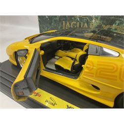 Two Maisto 1:12 scale Jaguar XJ220 ‘Racing’ cars in yellow, both on plinths in original boxes 