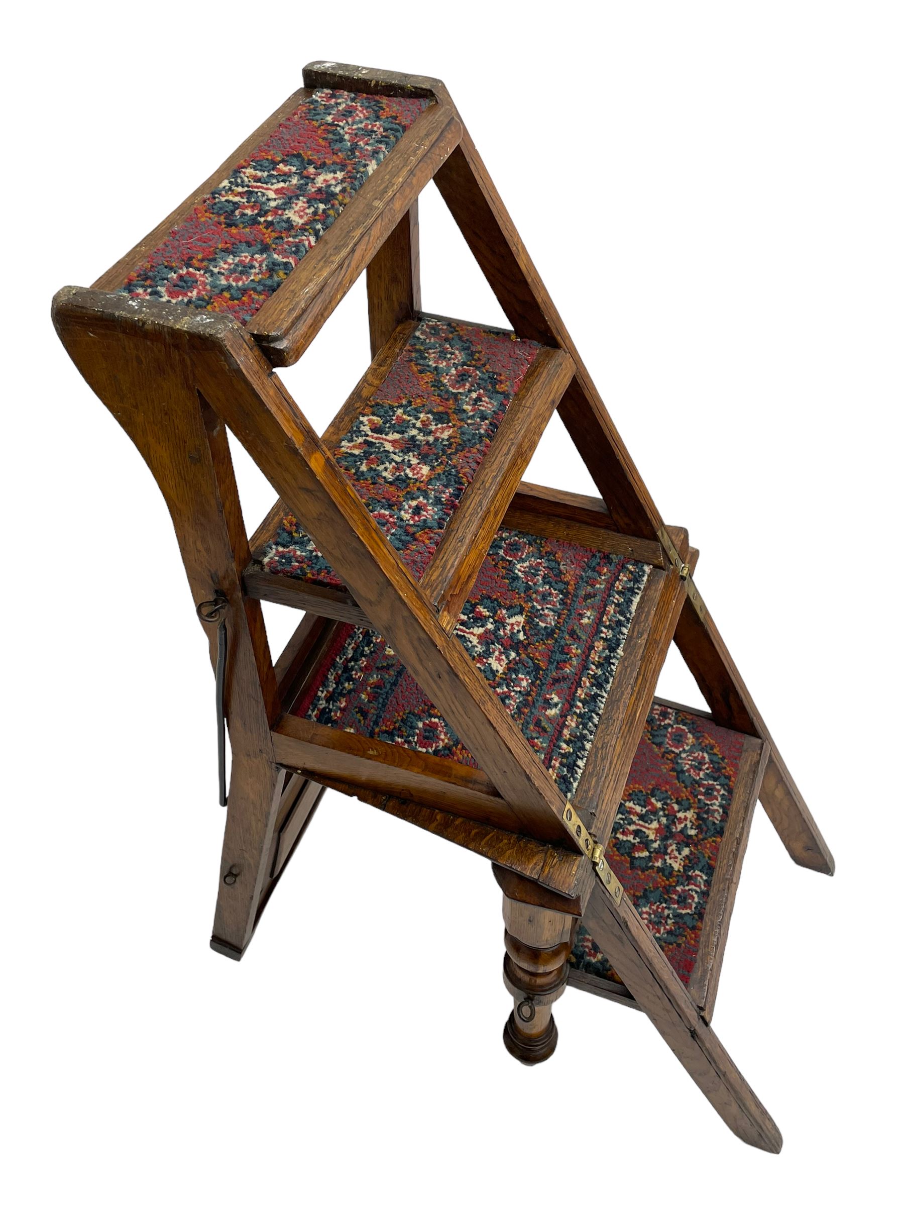 19th century oak metamorphic library steps and chair, panelled back with turned spindles over plank seat with turned front supports, the hinged seat folding forward, the steps inset with carpet treads  