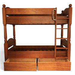Modern cherrywood single bunk beds, with ball finials, curved headboard and footboard, ladder and chrome hand rail, raised on turned supports, with two base drawers