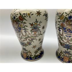 Pair ceramic urns and covers with gilded finials, decorated with cherubs and floral imagery, a pair of cream vases with blue detail and floral decoration, along with a pair of oriental urns and covers with a gilt metal base