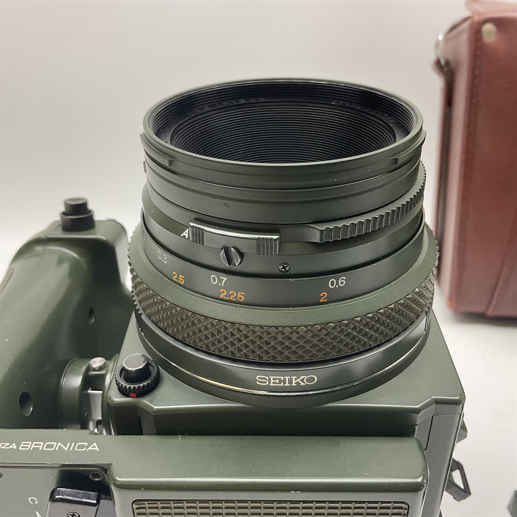 Zenza Bronica ETRS camera body, safari edition, serial no. 7100811, with 'Zenza Bronica Zenzanon EII 1:2.8 f=75mm' lens, serial no. 7908591, film magazine back, safari, serial no. 8100564, AE-ii metering head, safari, serial no. 617024, etc, all in leather case