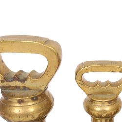 Graduating set of brass bell weights