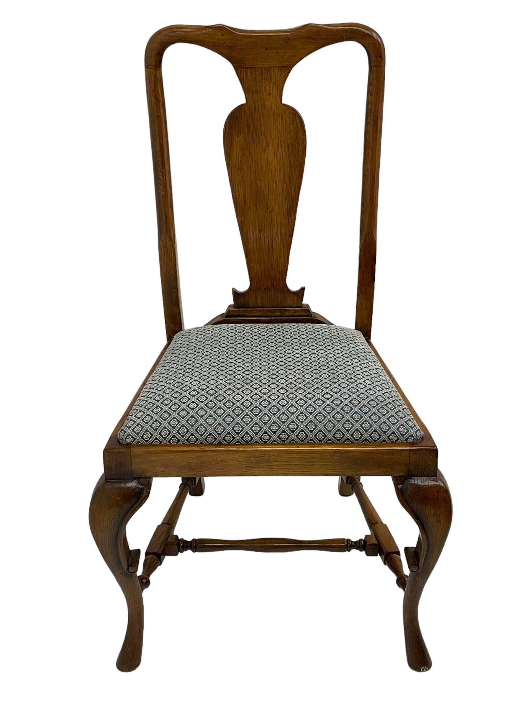 Late 20th century oak dining table, rectangular top with two draw leaf extensions, on turned supports united by moulded hayrake stretchers (180cm - 278cm x 90cm, H76cm); set of eight (6+2) oak dining chairs, shaped cresting rail over shaped splat back, upholster drop-in seat, on cabriole supports united by turned H-shaped stretchers 