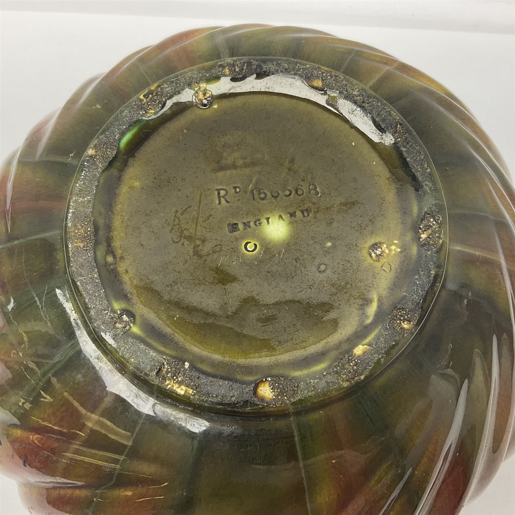 Bretby Jardiniere and stand, with foliate and foliage decoration with a red and yellow ground, impressed mark beneath H94cm