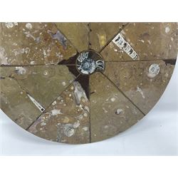 Circular limestone table top, with orthoceras and goniatite inclusions; age: Upper Devonian, location: Morocco, D45cm