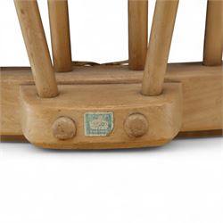 Ercol - Model '203', pair of easy chairs, with blue upholstered cushions and additional orange covers, with looped backrest and shaped spindles, outward swept arms, drop in seat frame