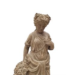 Hand carved stone Neoclassical figure of the Roman goddess Flora, her hair pinned with roses, draped in a toga, holding a basket of flowers in her right hand, raised on a stepped square plinth base 