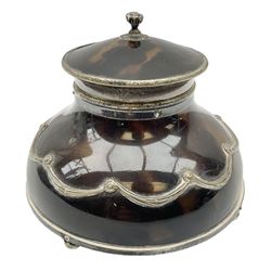 Edwardian silver and tortoiseshell inkwell by William Comyns & Sons, the domed hinged cover with bud finial opening to reveal the interior with clear glass liner, the domed body mounted with swags and raised upon four squashed bun feet, hallmarked William Comyns & Sons London 1906, H9cm