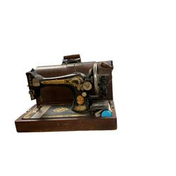 Cased Singer sewing machine, with two table lamps including a brass corinthian column example