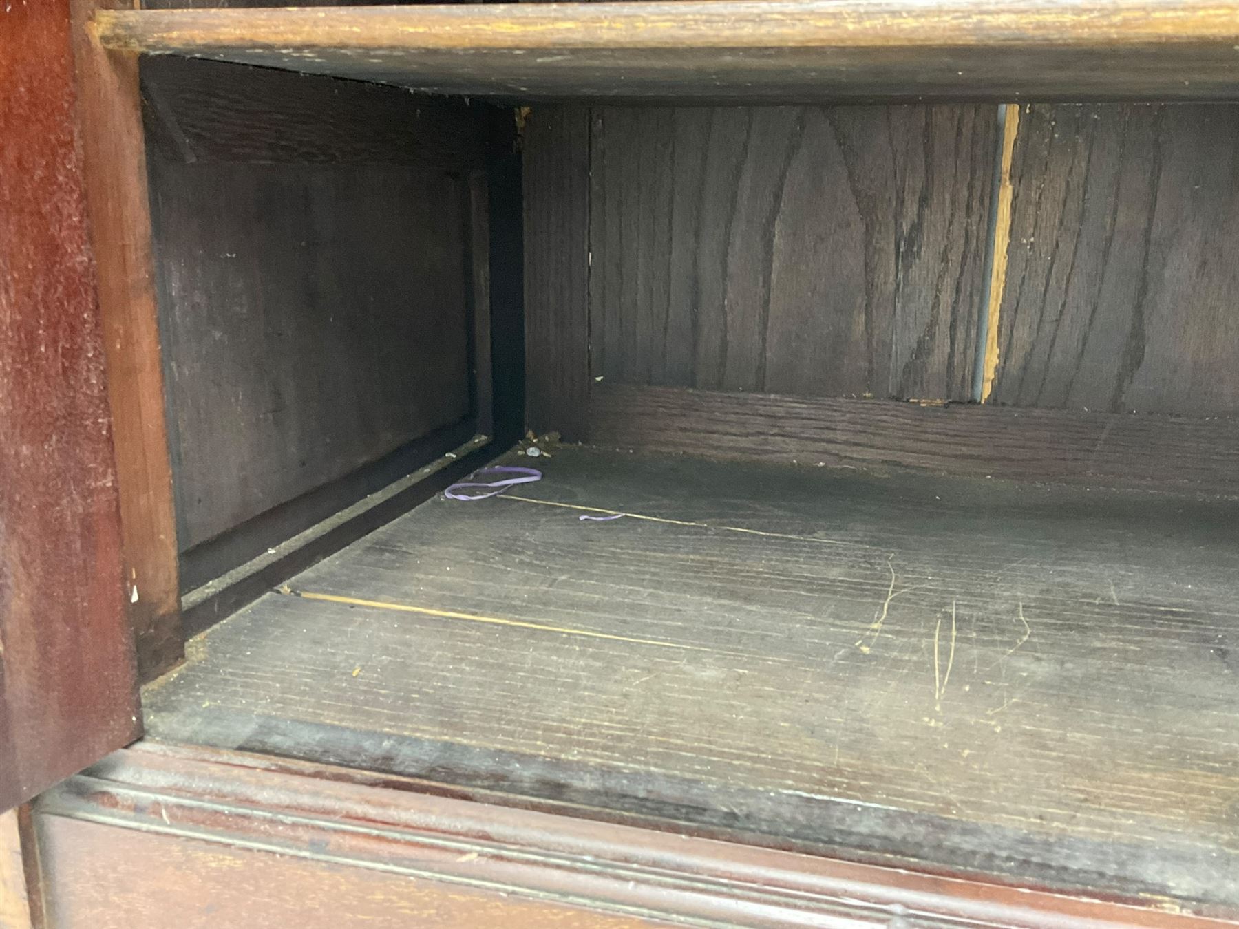 The Shannon Limited - late Victorian walnut filing cabinet, fitted with twenty-four small filing drawers, each with brass handle with label holder, fluted uprights, double cupboard below enclosed by two panelled doors, on turned feet, with brass plaque inscribed 'The Shannon, Limited, Ropemaker St. London, E.C.'