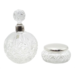  Shop stock: Silver mounted large cut glass perfume bottle 17cm and a cut glass dressing table jar with silver top 10cm both hallmarked and boxed  