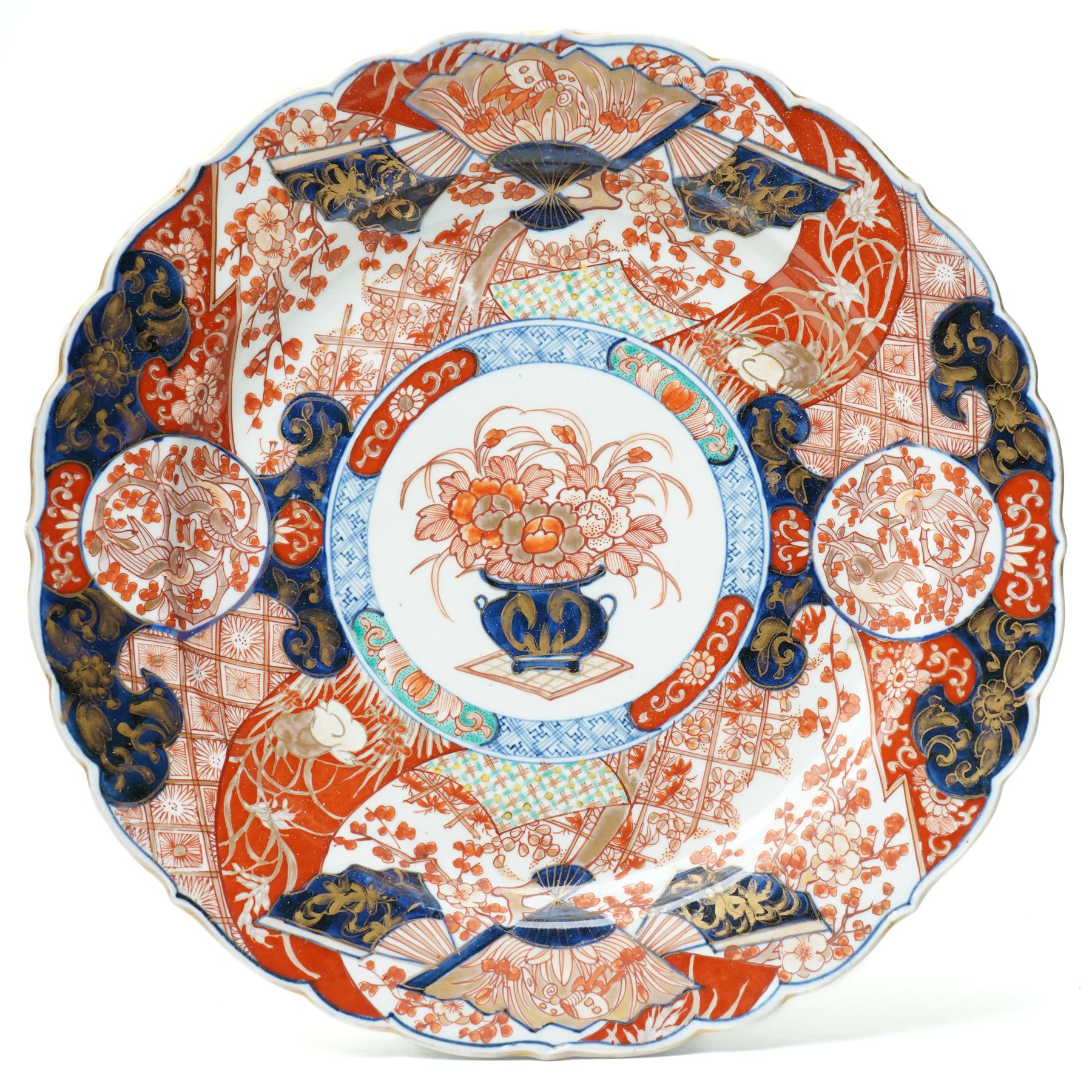 Japanese Meiji period imari charger, painted centrally with vase and floral bouquet, surrounded by fans and traditional motifs, D34cm 