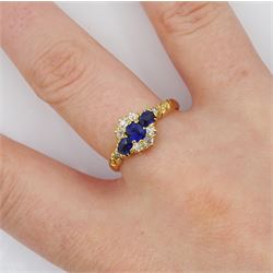 Victorian 18ct gold sapphire and diamond cluster ring, with engraved scroll design shoulders, Birmingham 1896