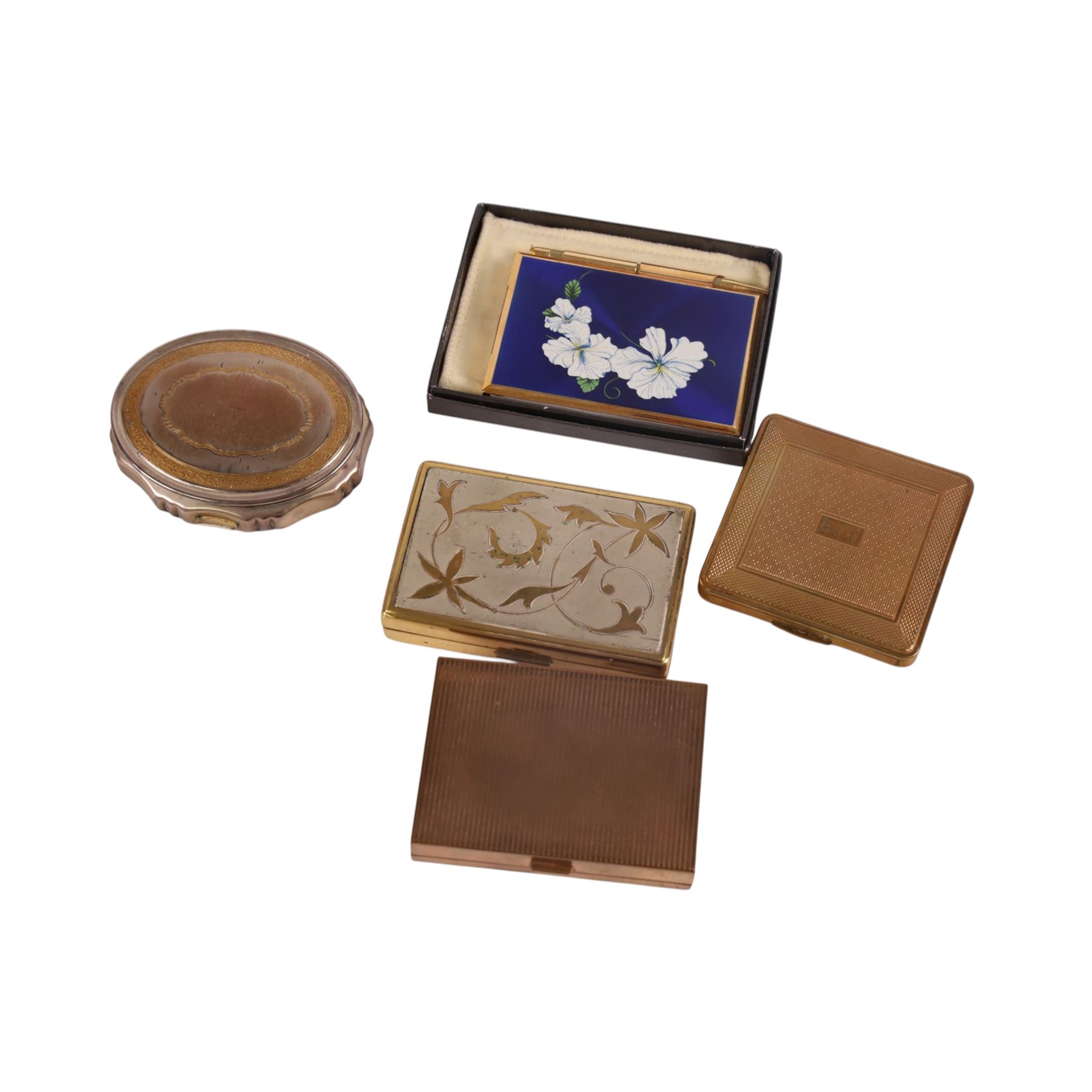 Collection of vintage powder compacts, including musical, Stratton Christian Dior, and Kigu examples