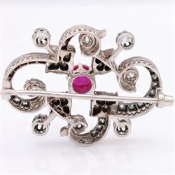 19th century French 18ct white gold ruby and diamond brooch by Eugène Fontenay, centrally set with a single cabochon cut ruby of approx 1.85 carat, the foliate scroll border set with eight old cut diamonds of approx 1.45 carat and rose cut diamonds, stamped with makers mark EF, eagles head and numbered 23960