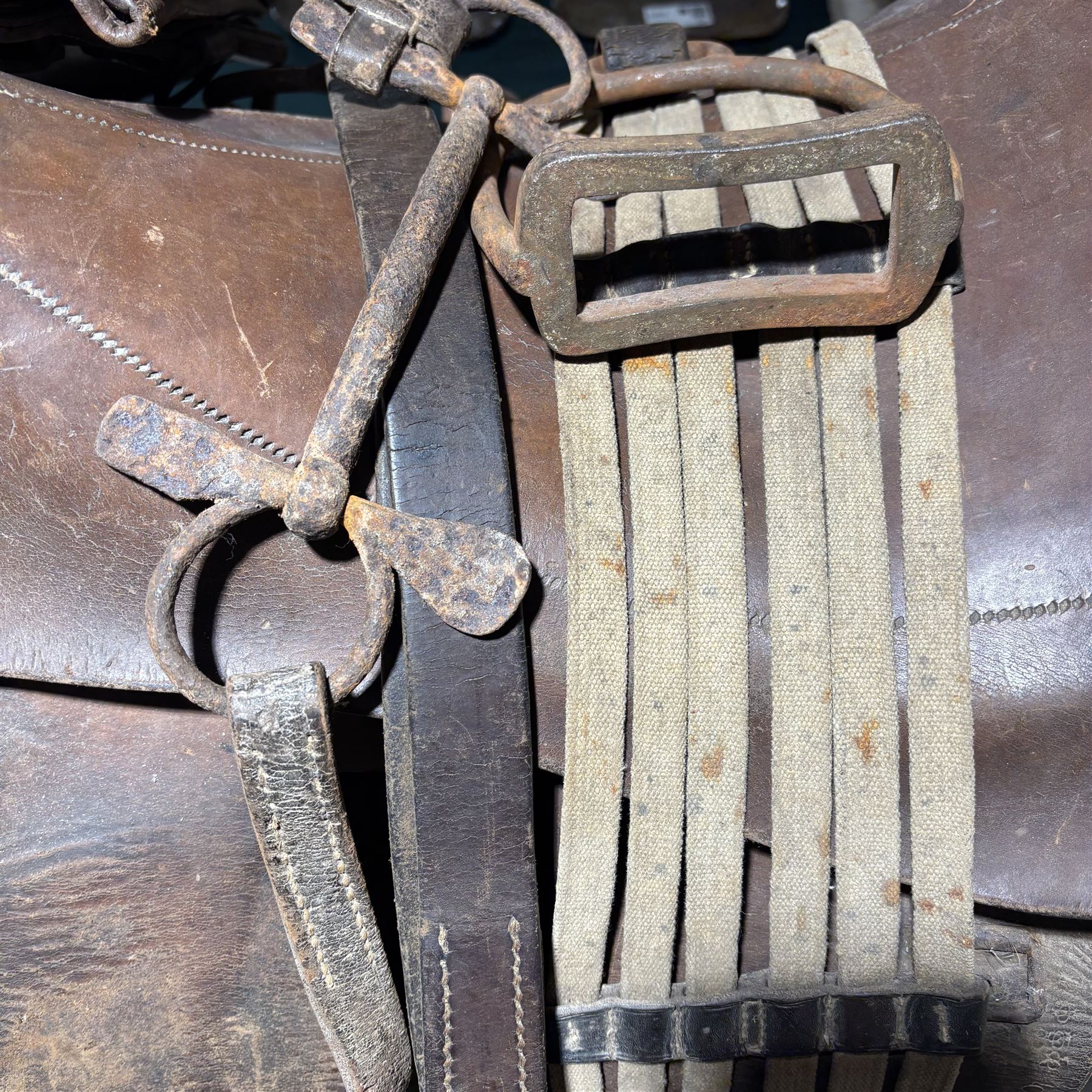 WWI French cavalry 17'' saddle, model 1916, with leather saddle bags, stirrups, girth and bit  