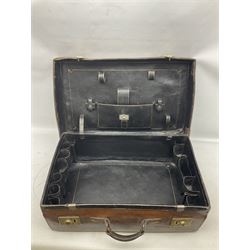 Late 19th/early 20th century brown leather suitcase, with two brass locks stamped B. Finnigan, Manchester, opening to reveal gilt tooled black compartmented interior, together with a Gladstone bag bearing initials H.A., suitcase W60cm D37cm H20cm