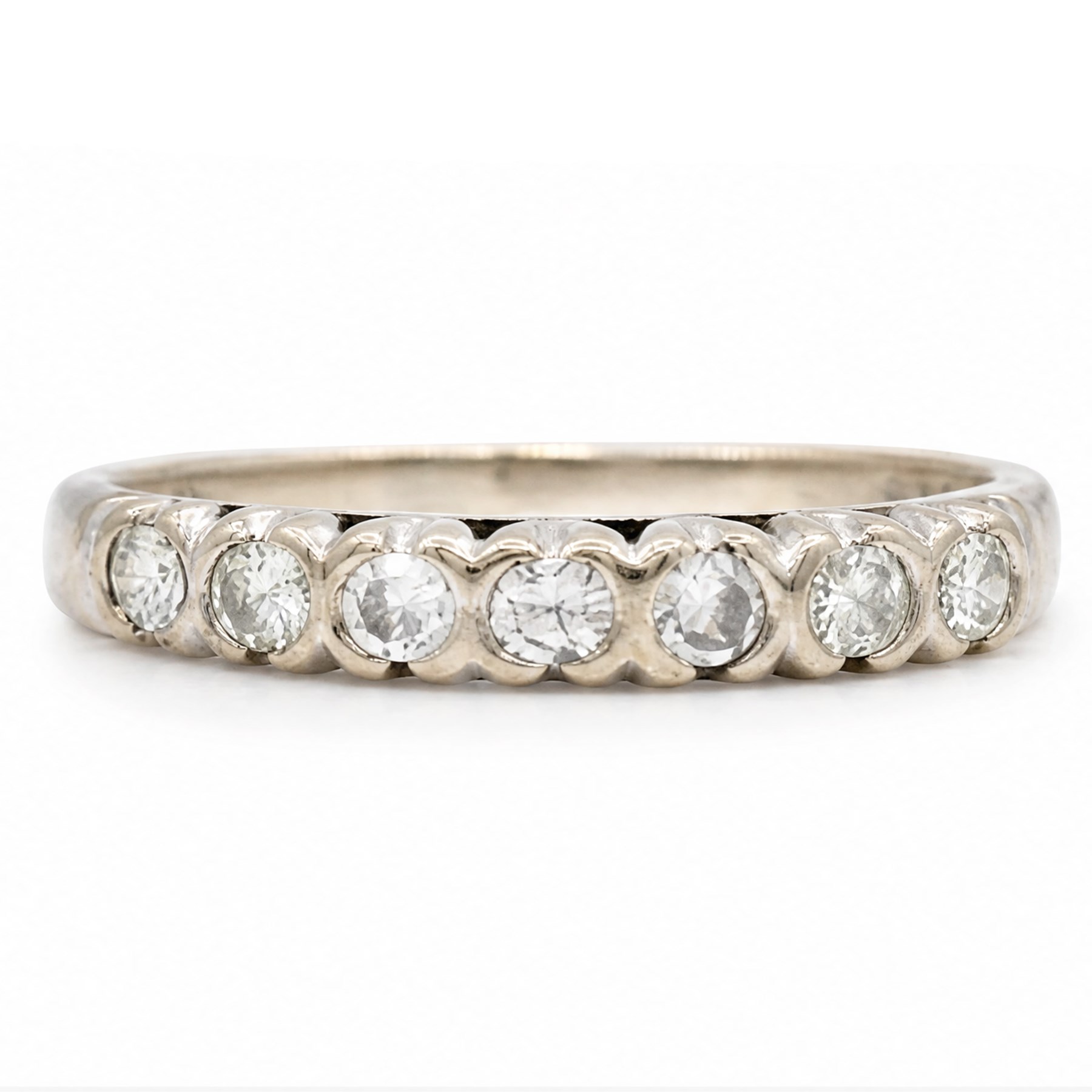 18ct white gold diamond half eternity ring, set with seven round brilliant cut diamonds, London 1974, total diamond weight approx 0.35 carat