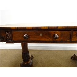  Regency rosewood rectangular Library table, two real and two false frieze drawers with anthemion carved mounts and handles, on lotus carved turned tapered supports with scroll carved paw feet, L137cm, W70cm, H75cm   