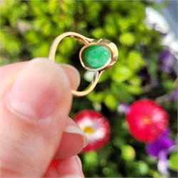 Early - mid 20th century gold jade ring, bezel set with a single oval cabochon jade of approx 4.10 carat, stamped 18ct