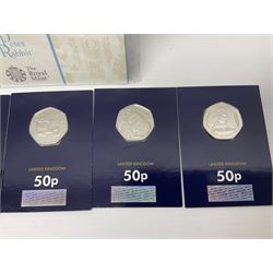 Mostly United Kingdom Queen Elizabeth II commemorative fifty pence coins, including 2019 'Gruffalo', 2020 'Iguanodon', 2022 'The Queen's Jubilee' etc, housed on cards, face value of UK coins approximately 20 GBP