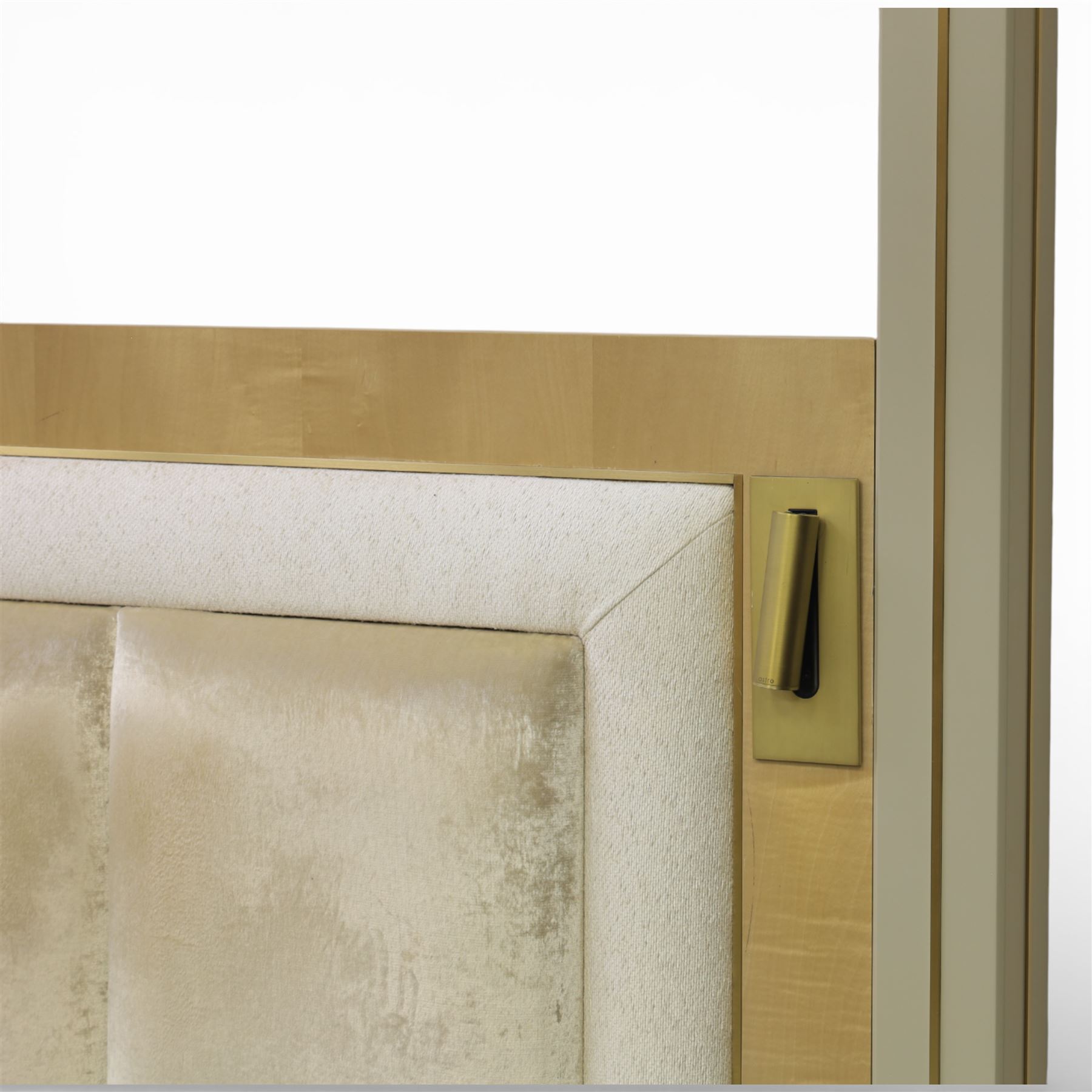 Contemporary maple and inlaid brass Emperor sized four poster bed, rectangular canopy frame with square section uprights, panelled headboard incorporating a padded upholstered inset, flanked by brass reading light fittings, low footboard with moulded panel detail, raised on square inlaid brass supports