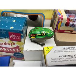 Twenty six tinplate models to include Ferris Wheel and Performing Circus Elephant, marked JW, further similar examples such as Duck on a Bike, Clown on Roller, Carousel; Popeye Tin Speedboat; Looney Tunes Wind Up Cars and Express Train; various international examples, MS107 Jumping Bambi, Pop Pop Boat, jumping frogs, pecking chickens etc; both boxed and loose