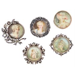 Five 19th century silver portrait brooches, two set with portraits of cherubs and three wi...