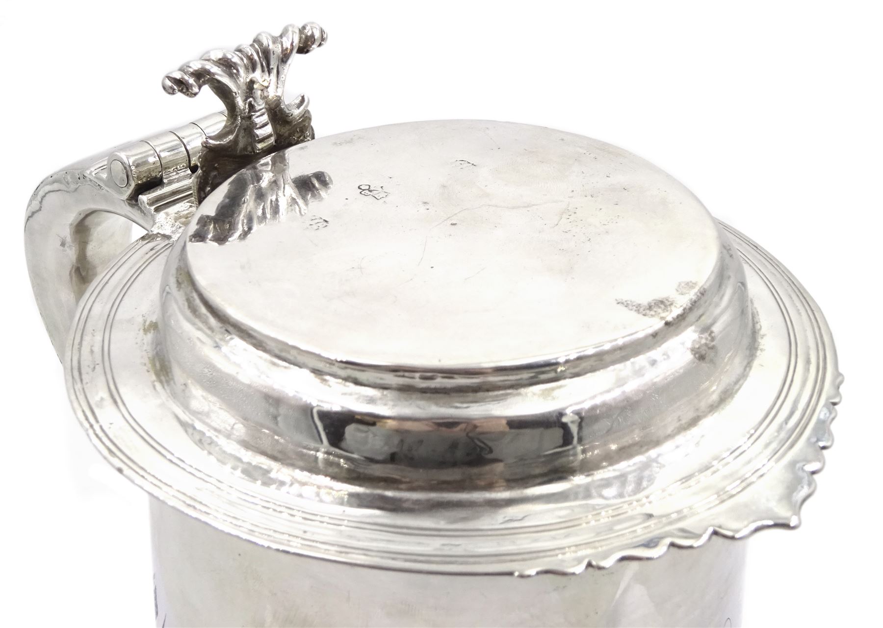Queen Anne silver tankard, of plain tapering cylindrical form, with stepped and flat-domed cover, twit cast thumbpiece and curved handle, the body engraved with eagle crest, hallmarked Abraham Barachin, Hull, circa 1706, the body and cover stamped once with makers mark and twice with town mark, H18cm, approximate weight 21.46 ozt (667.7 grams)
