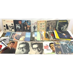 A collection of approximately 35 vinyl records, to include Buddy Holly two The Buddy Holly Story LVA 9105 examples with differing covers, The Buddy Holly Story Vol. II LVA 9127, Buddy Holly LVA 9085, and a selection of various singles, including 80's rock examples, etc. 