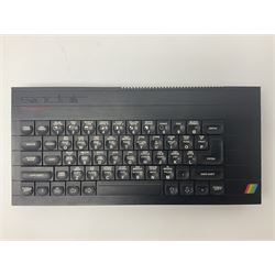 Sinclair ZX Spectrum (1984) with accessories and games; ten games for Sinclair Spectrum and 48K Spectrum to include ‘Knight Lore’, ‘The Way of the Exploding Fist’, and ‘Green Beret’ all in original boxes, ‘Rambo First Blood Part II’ without original box; Sinclair UK1400 Power Supply Unit, Hales Universal Mains Adapter, RAM Turbo Spectrum Joystick Interface, Starlite Cassette Player, all without boxes