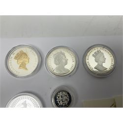 Thirteen silver coins, including Queen Elizabeth II Solomon Islands 2002 sterling silver five dollars, Alderney 2002 sterling silver five pounds, Fiji 2002 sterling silver ten dollars, United Kingdom 2003 one ounce fine silver Britannia, 2003 'Give Women The Vote' fifty pence etc, all with some form of certificate