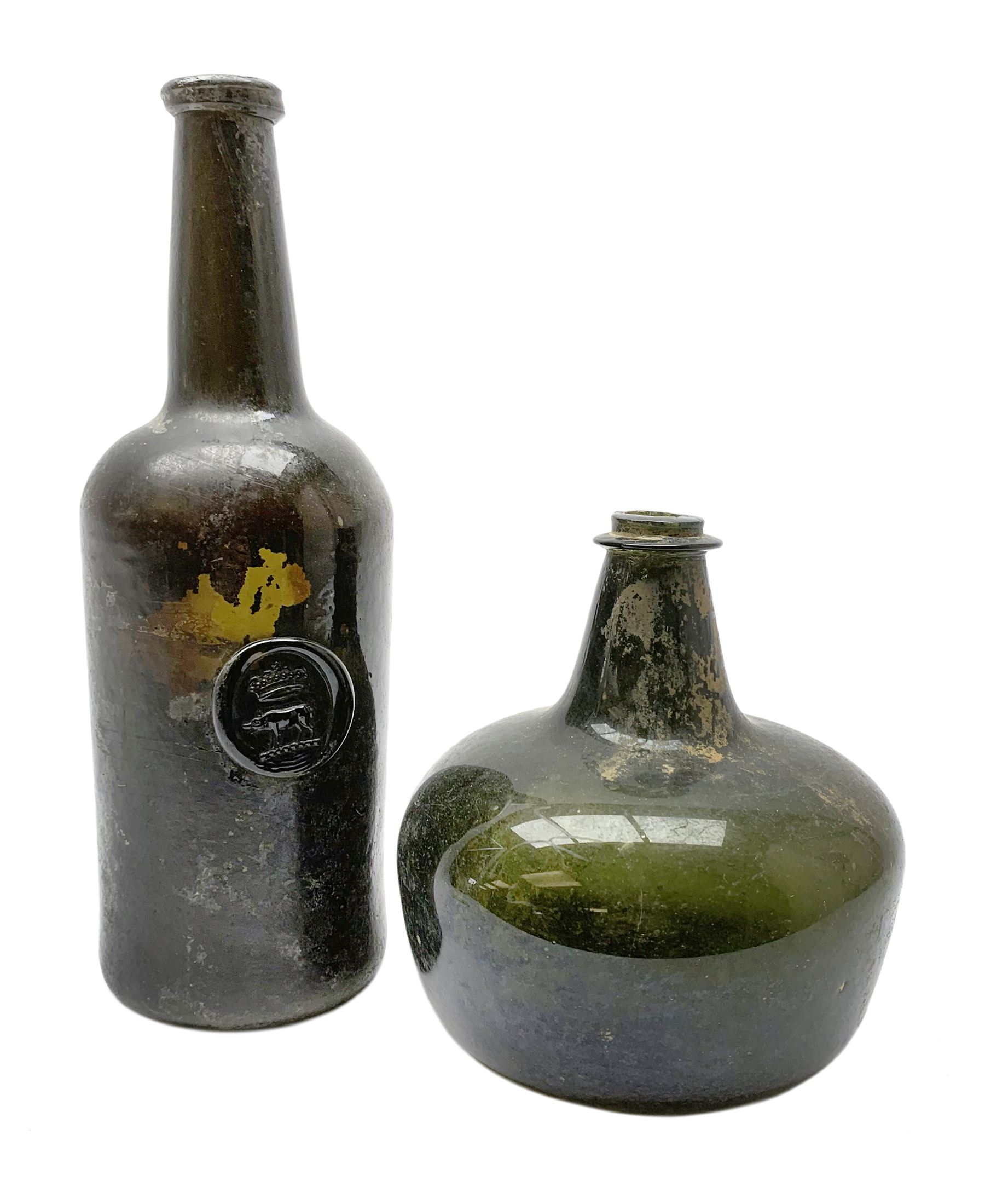 18th century green glass bottle, of onion form, H15cm, together with an 18th century green glass wine bottle, with seal depicting a boar beneath a crown, probably the Edgcumbe Crest, H27cm