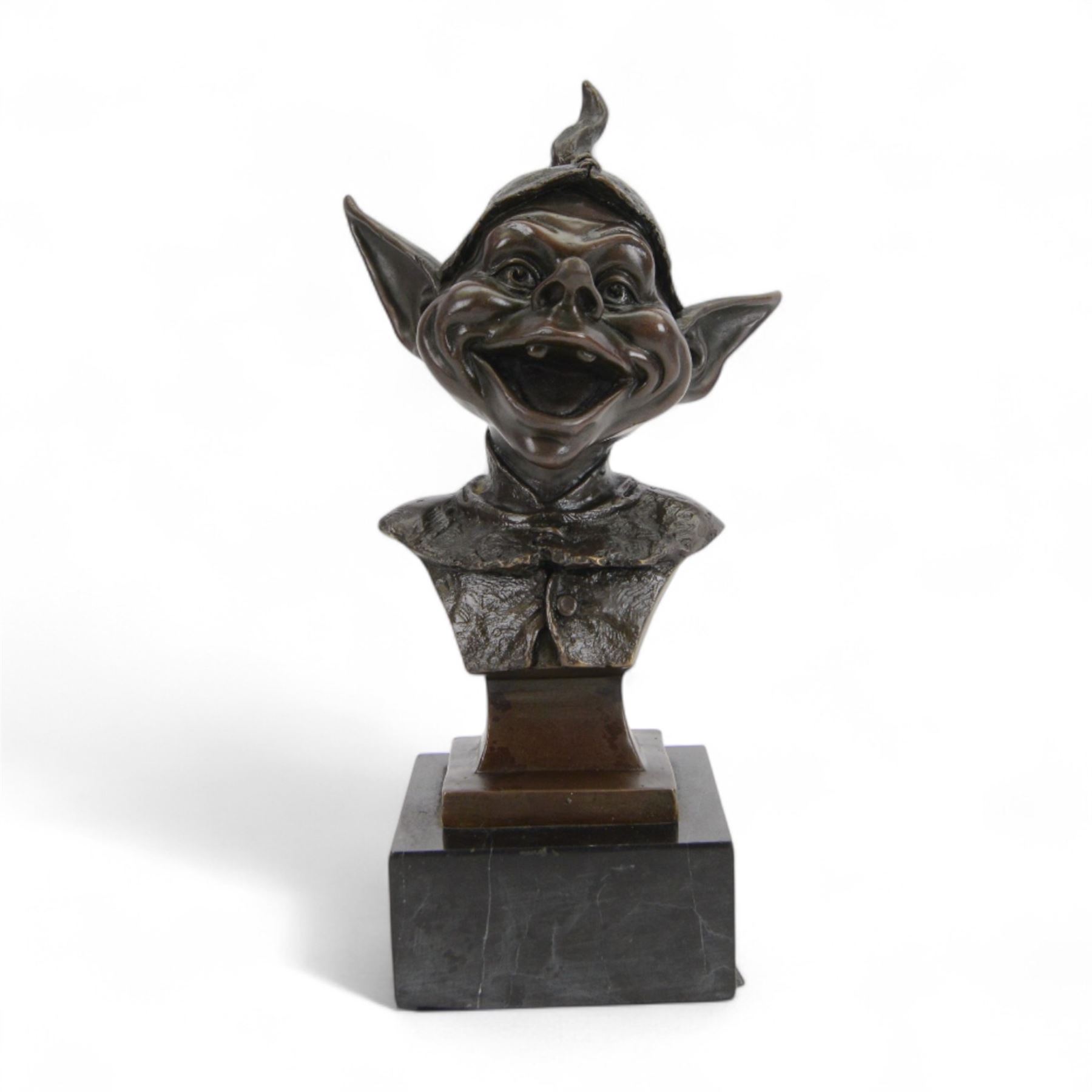 Modern bronze bust of a goblin upon a square black marble base, signed Juno, H28cm