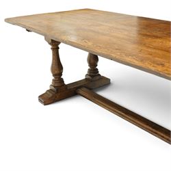 Large 17th century design oak 10ft refectory dining table, the rectangular top raised on twin double-vasiform pedestal end supports on sledge feet, united by chamfered stretcher