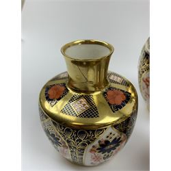 A selection of Imari pattern Royal Crown Derby, comprising rectangular lidded trinket box, vase and cover, squat bulbous vase with twin handles, further vase, and cover, (a/f, for restoration). 