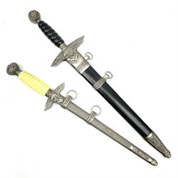 Two reproduction WW2 German daggers - Luftwaffe officer's first pattern; and Luftwaffe officer's second pattern; each with scabbard (2)