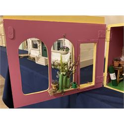 Three scratch-built wooden shop dioramas - single room Pet Shop with hinged front, fully furnished and well stocked with animals, birds and numerous accessories; and matching Garden Shop, fully furnished and well stocked with fruit, vegetables and garden accessories including lawn mower, wheelbarrows etc; each W34cm H27cm D26cm; and double fronted single room Butchers Shop with butcher at his block, partially stocked counter and two delivery cycles W57cm (3)