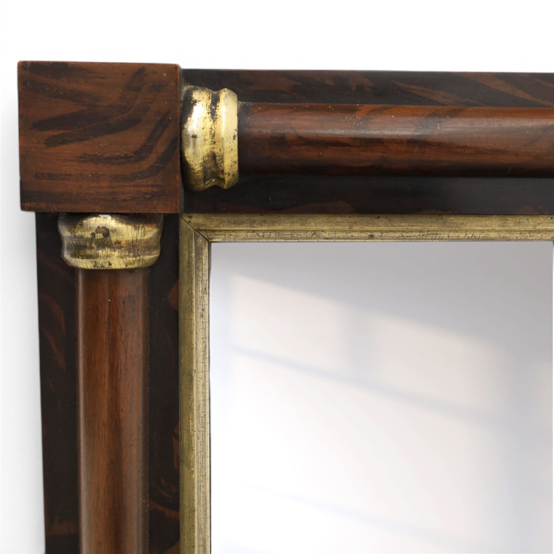 19th century brass and simulated rosewood mirror, with ceramic finials