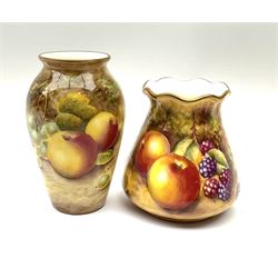 Two small Royal Worcester fruit painted vases, hand painted with apples and grapes, and apples and blackberries, the first example shape no 461 signed S Drysdale, H10cm, the second example shape no 957 signed J Nutt, H8cm, each with black printed marks beneath. 